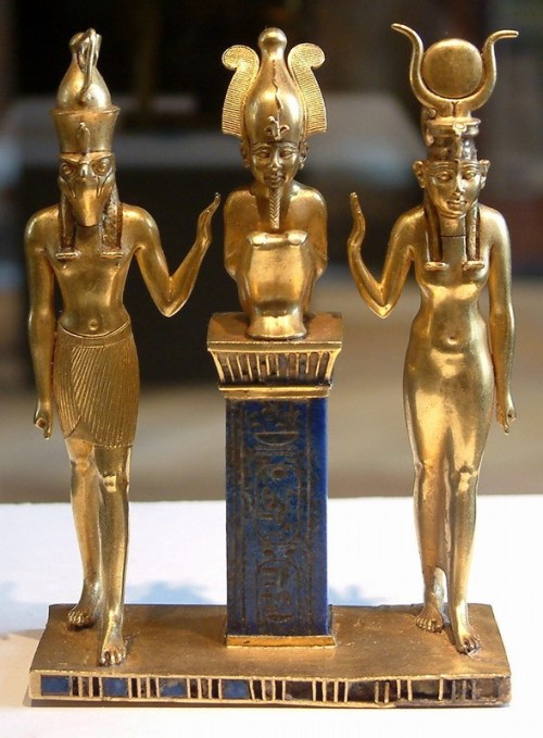 Osiris on a lapis lazuli pillar in the middle, flanked by Horus on the left and Isis on the right (22nd dynasty, Louvre, Paris). Public Domain Uploaded by Borislav Created: between 874 and 850 BC (Twenty-second dynasty) Guillaume Blanchard, Own work, July 2004,  Osiris, Isis and Horus: pendant bearing the name of King Osorkon II http://en.wikipedia.org/wiki/Osiris#/media/File:Egypte_louvre_066.jpg