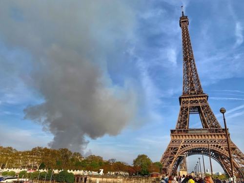 Q the view of the Notre Dame Fire From Michael's Cruise Boat on the Seine April 17 2019 michelle-obama-paris-cruise-alain-ducasse-photos-1